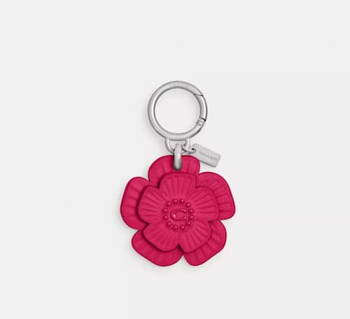 Coach Outlet: Tea Rose Bag Charm, Glovetanned Leather/Silver/Dragonfruit | Photo: Coach