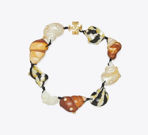 Tory Burch: Shell Statement Necklace, Rolled Light Brass/Multi | Photo: Tory Burch